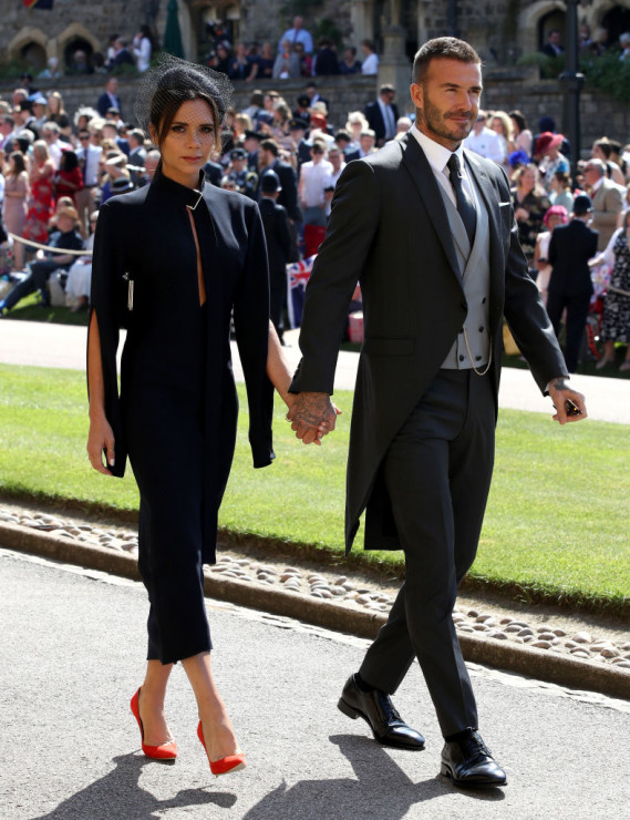 Victoria Beckham i David Beckham na ślubie księcia Harry'ego i Meghan Markle w kaplicy św. Jerzego na zamku Windsor 19 maja 2018 r. w Windsorze w Anglii.